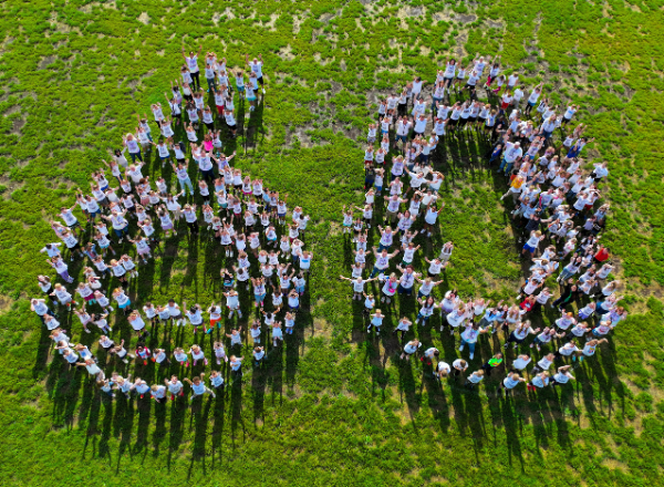  Sequiota students and staff celebrate 60 years by standing in the shape of a 6 and a 0